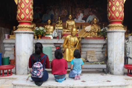 Worshippers at the Doi Suthep temple in Chiang Mai, Thailand